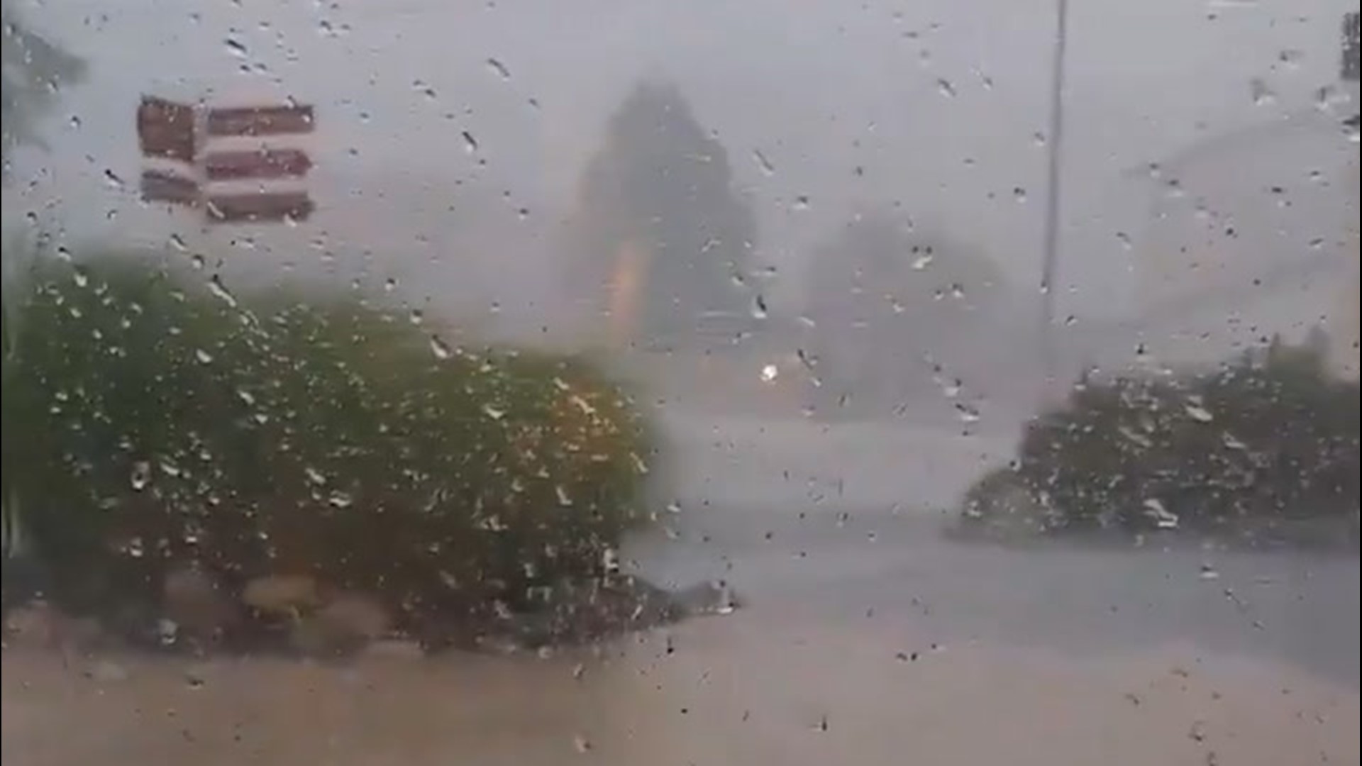 You can hear hail pelt the roof as it litters the ground in the town of Battle Creek on June 10. Heavy rainfall left the area drenched.