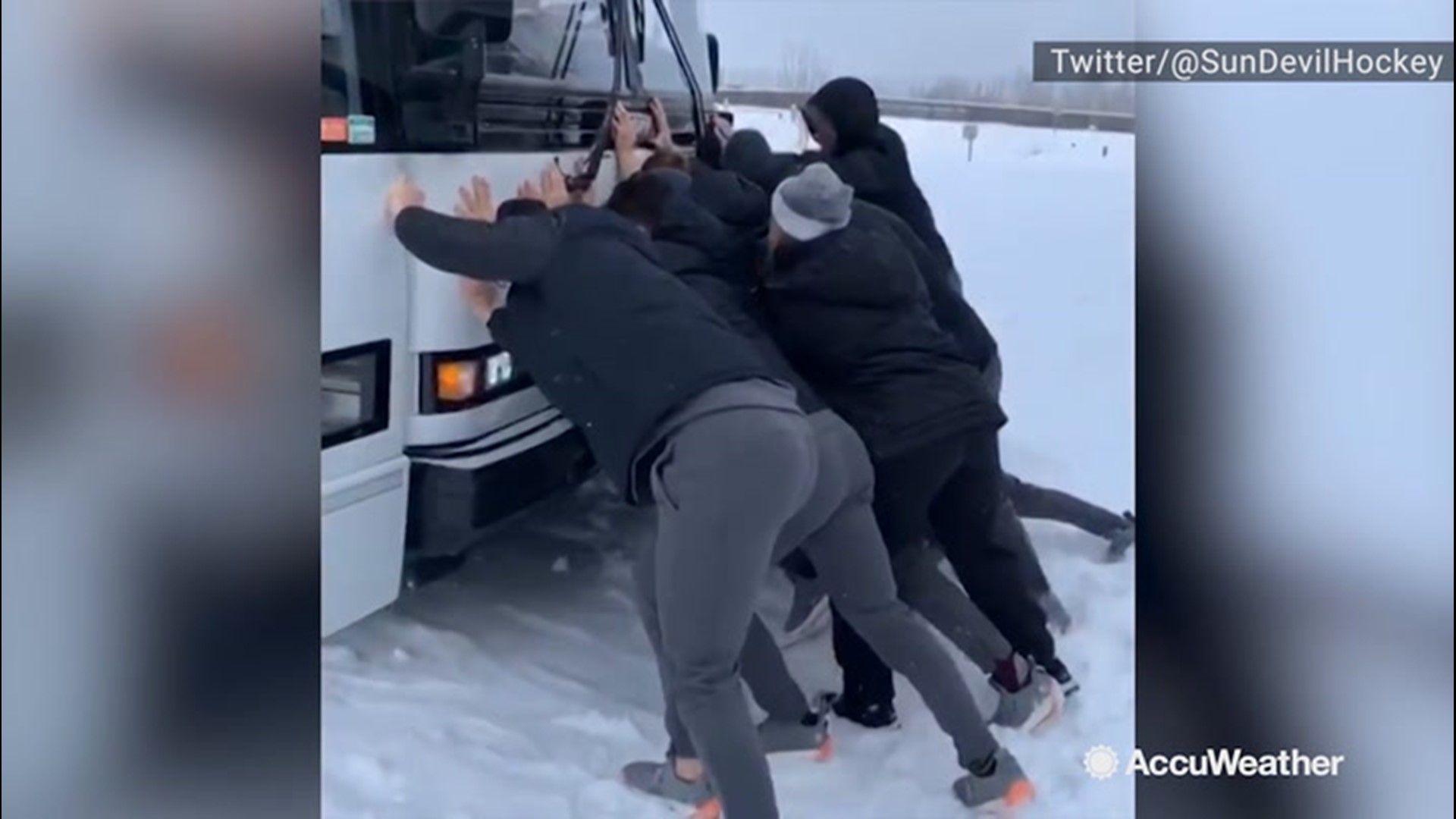 In College, Alaska, the Arizona State Sun Devils' bus became stuck in the snow on Nov. 8. The hockey team jumped into action and tried to get the bus moving again.