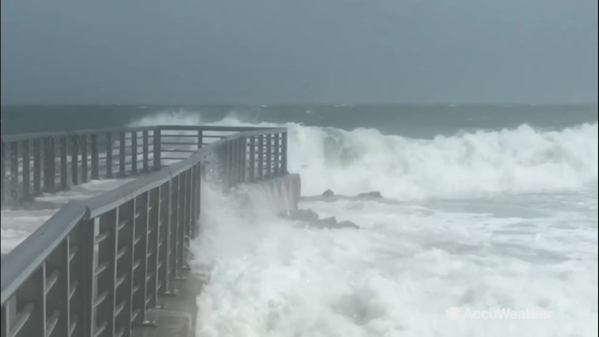 Storm chaser Reed Timmer captures footage of savage waves crashing into a pier at Sebastian Inlet, Florida, on Sept. 2.