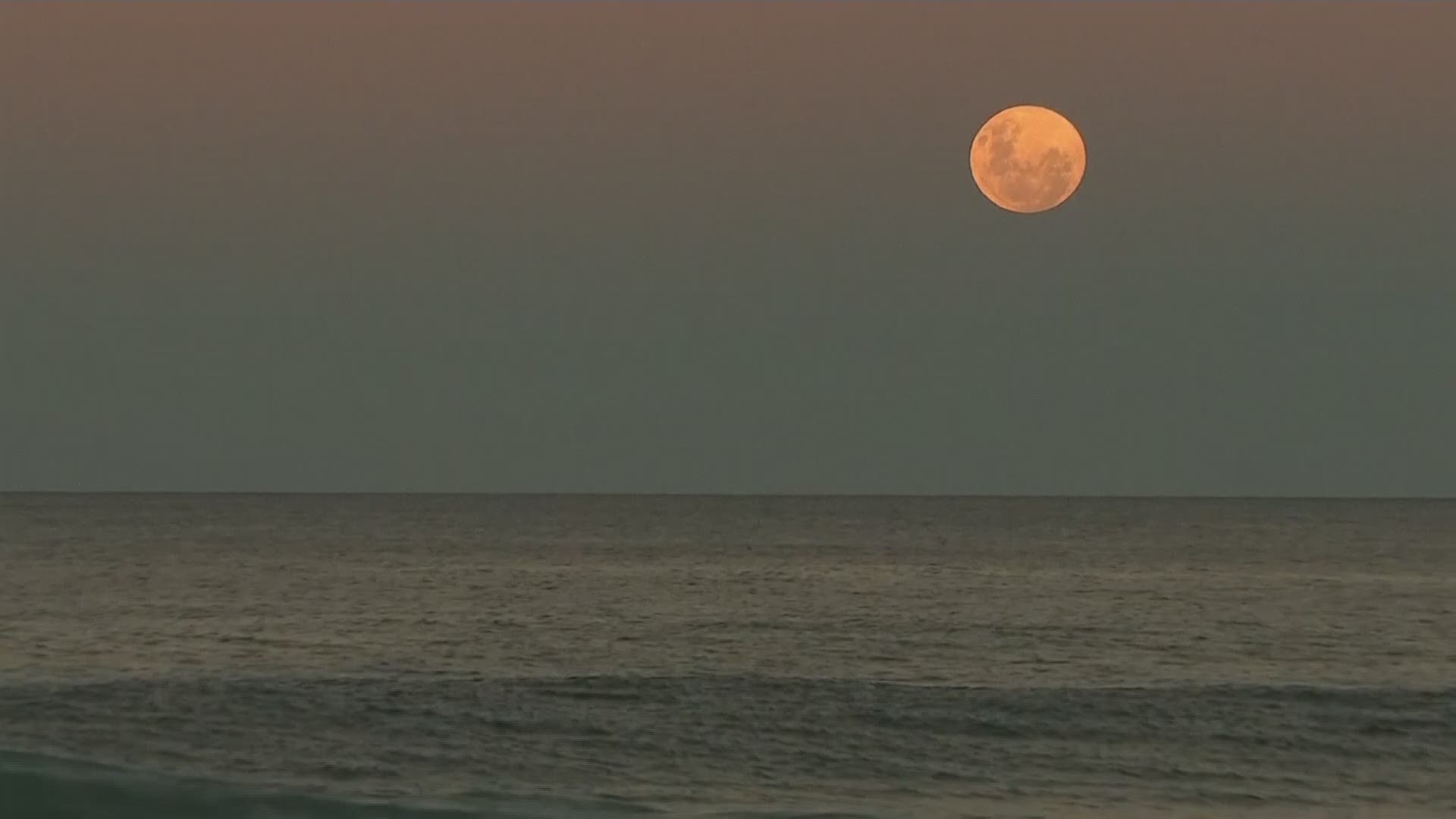 Earth's shadow crept across the moon on Wednesday night in Australia as people waited for a cosmic event known as a super blood moon.