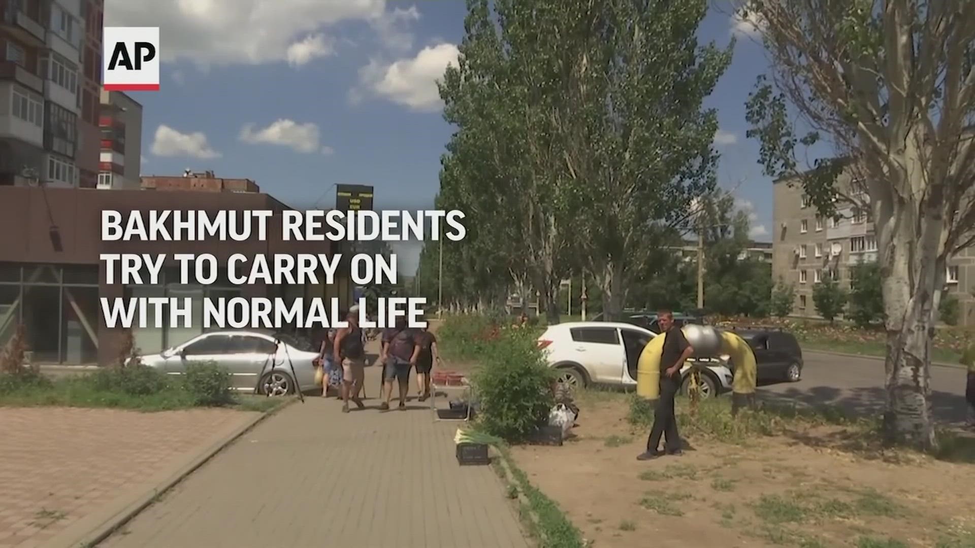 WATCH: Under a sky filled with the sound of missiles soaring overhead, people in the eastern Ukrainian city of Bakhmut try to carry on with normal life.