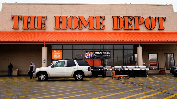 Home Depot cuts its outlook as Americans cool spending on homes