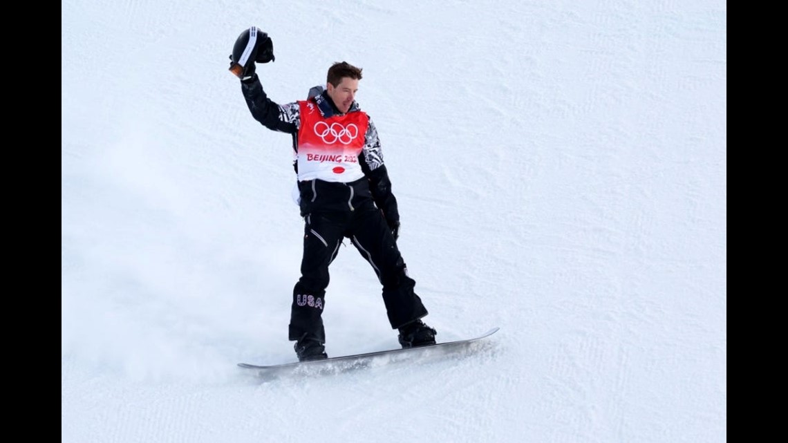 Snowboarder Shaun White, of Carlsbad, Calif., raises his arms at the bottom  of the superpipe after winning tonight's competition on Sunday, Jan., 27,  2008, at the Winter X Games at Buttermilk Ski