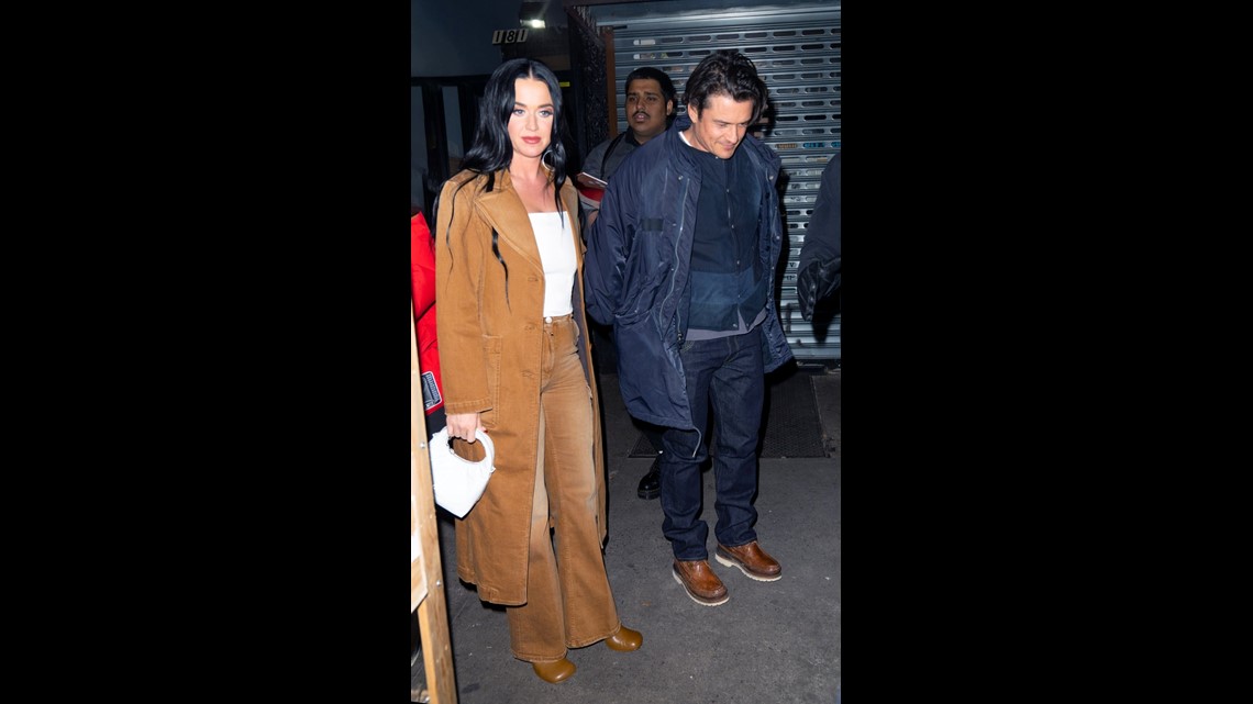 Katy Perry and fiancé Orlando Bloom exit swanky French restaurant during  stay in Paris
