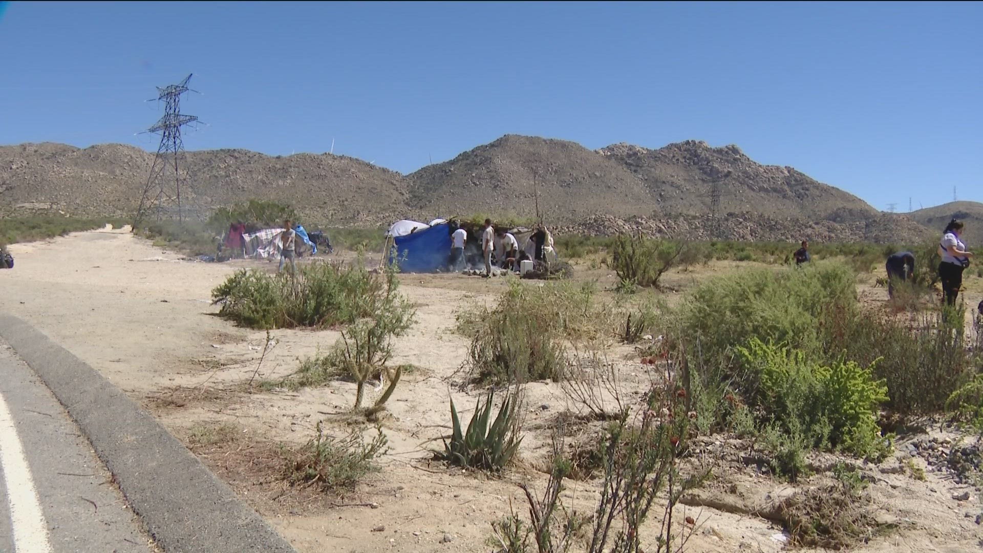 A dozen migrants camped in the desolate area as they waited to be picked up and processed by U.S. Border Patrol.
