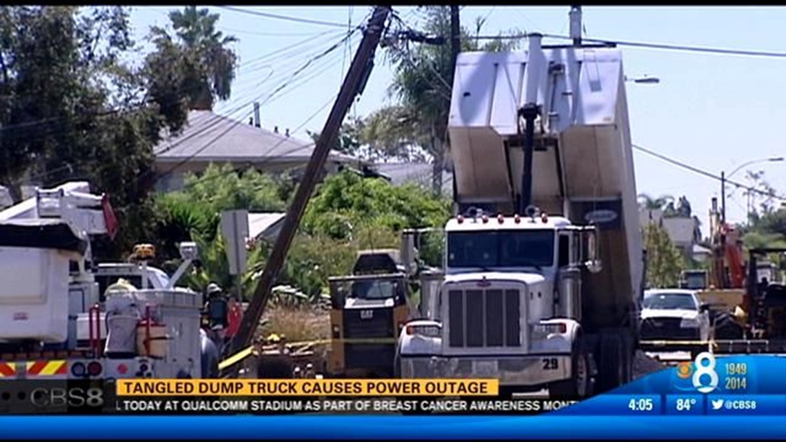 Tangled dump truck causes power outage in North Park | cbs8.com
