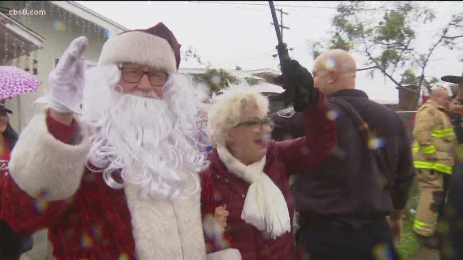 Santa Claus made some early stops Monday as San Diego city firefighters joined him on his route to deliver Christmas presents to nine families around San Diego.
