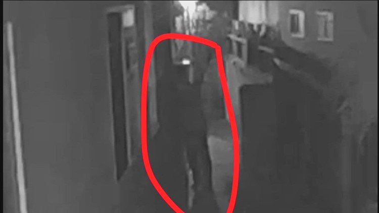 Terrifying moment 'ghost' is caught staring at man through a