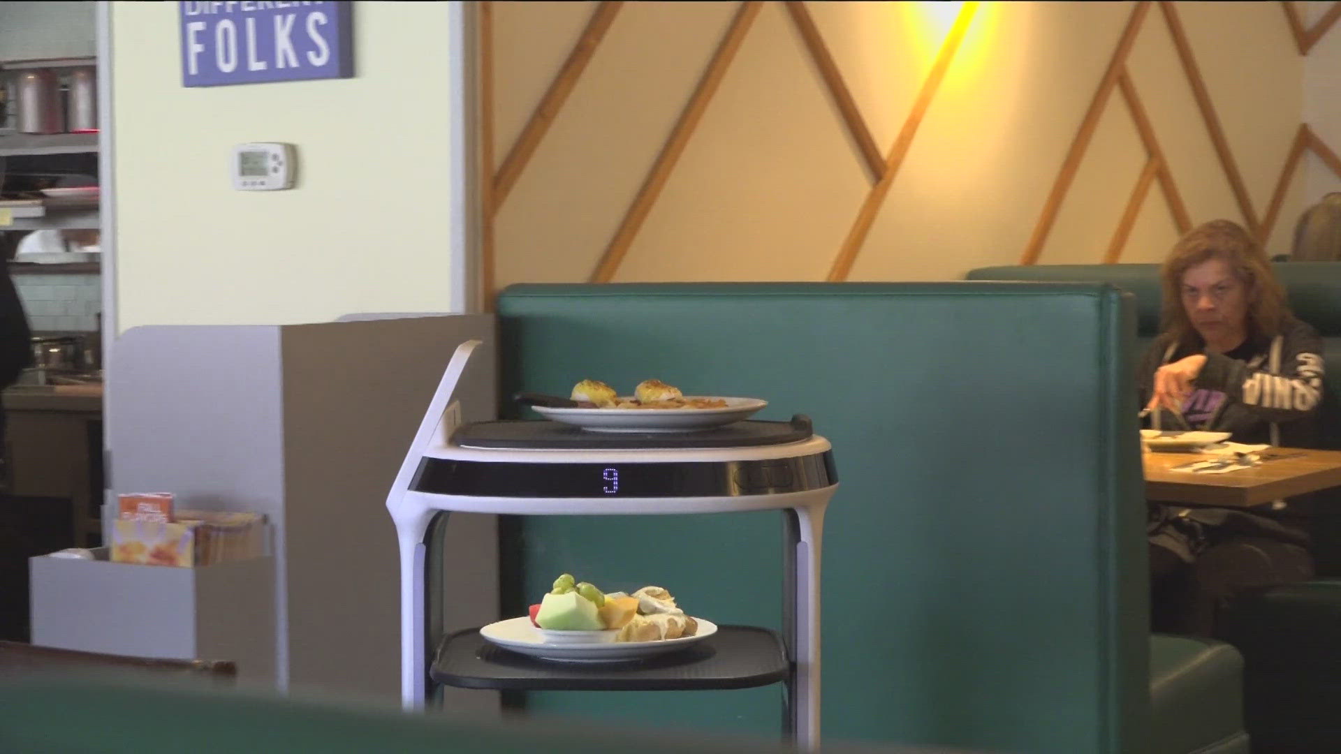 The robot assists servers and bussers at the popular breakfast spot. Pacific Beach is the only location in the country to have one.