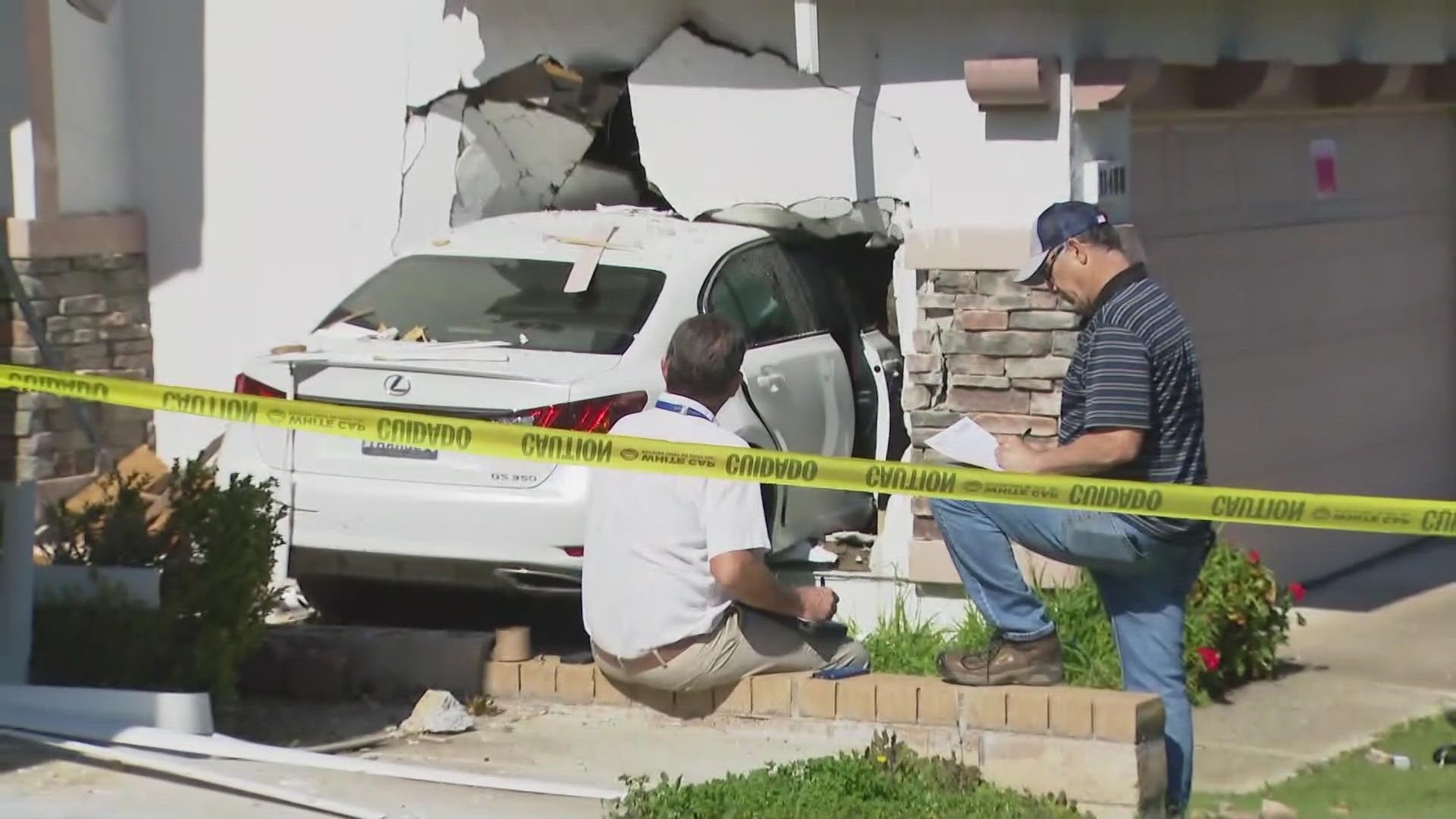 No one was injured after a driver launched her car over a home's driveway and into the side of a garage, according to police.