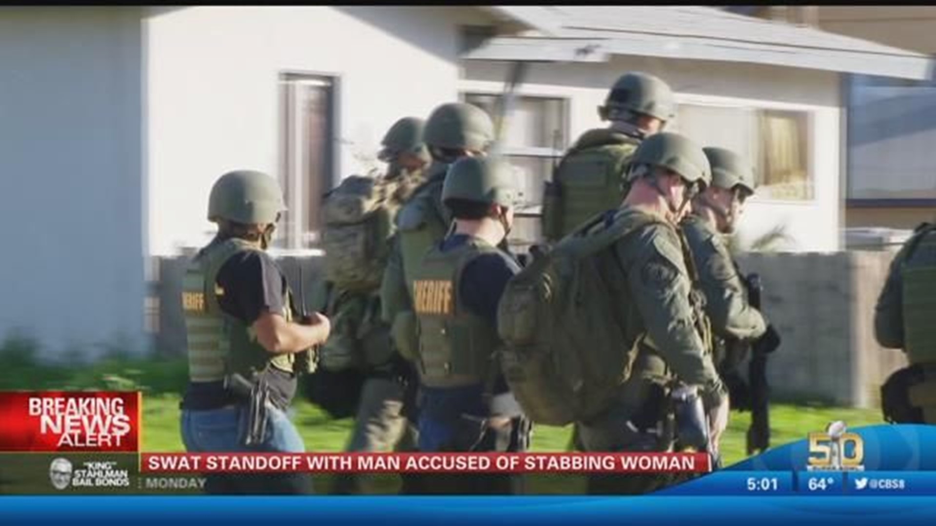 SWAT standoff with man accused of stabbing woman