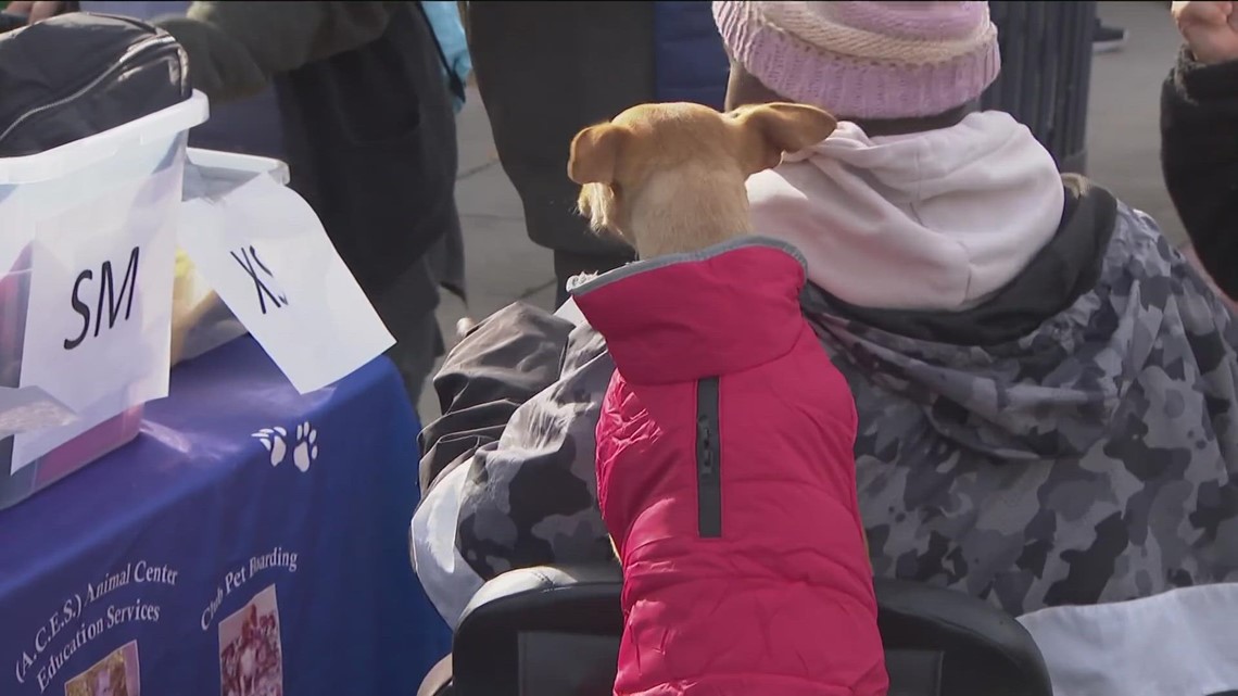 Homeless individuals receive blankets and sweaters for their pets