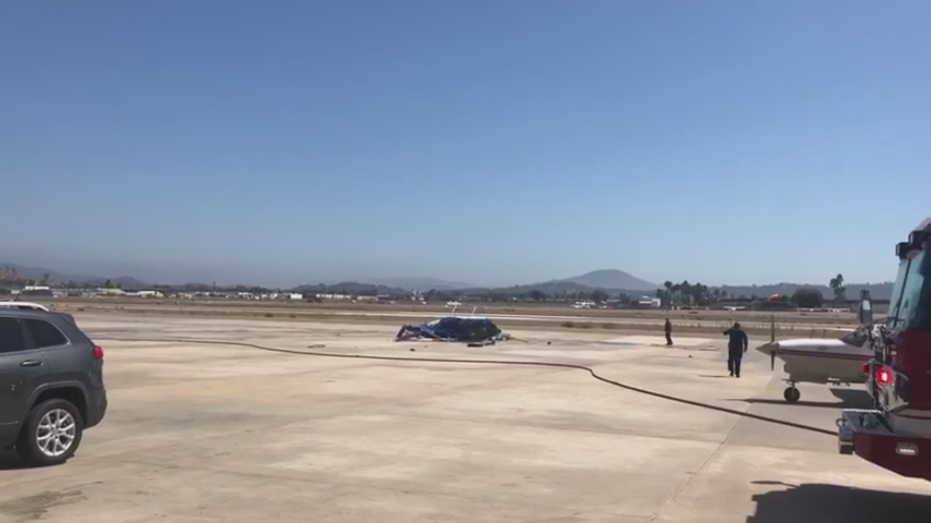Video from Jill Barto captures news helicopter on its side at Gillespie Field San Diego