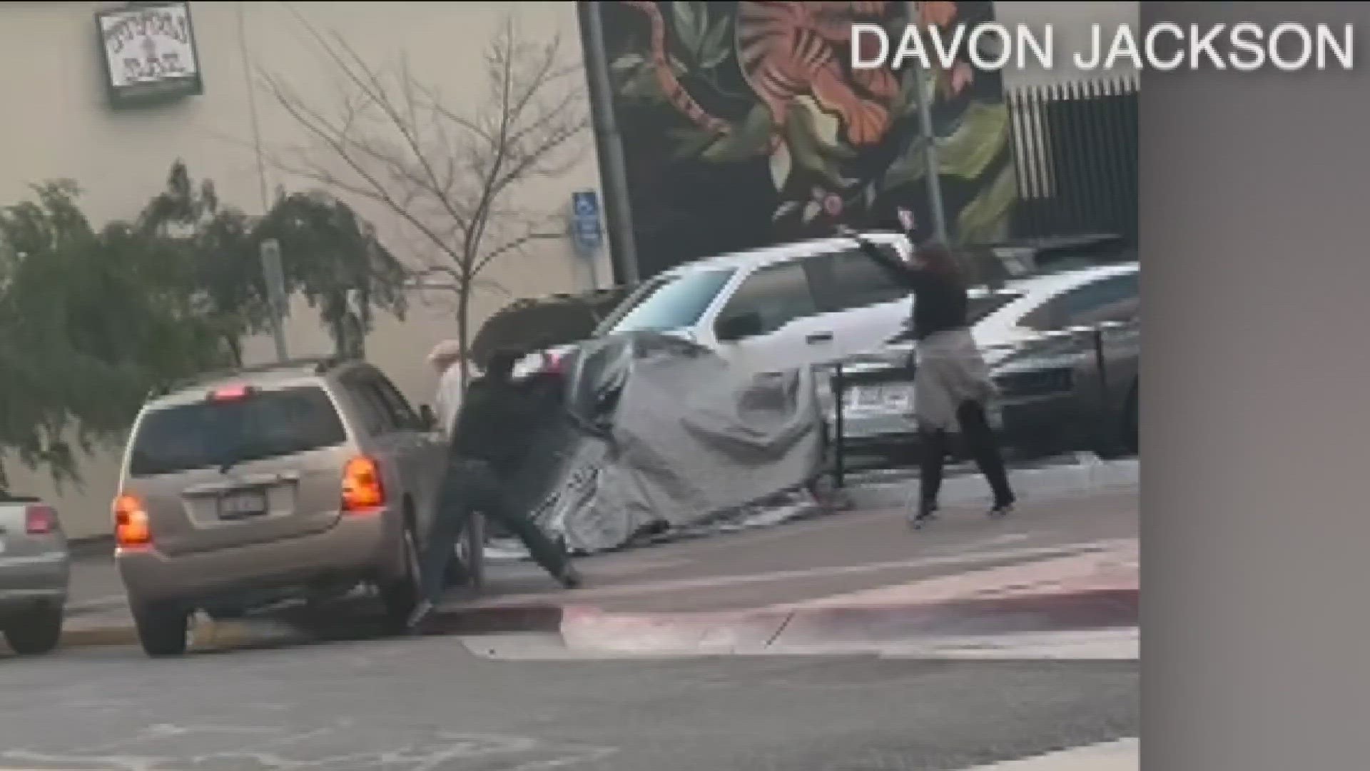 Video shared with CBS 8 showed a brown SUV driving erratically onto the sidewalk where a bat-wielding man was standing.