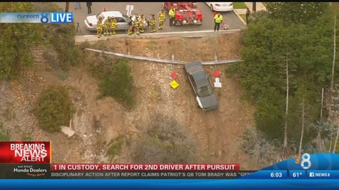 Car plunges down embankment in University Heights after chase | cbs8.com