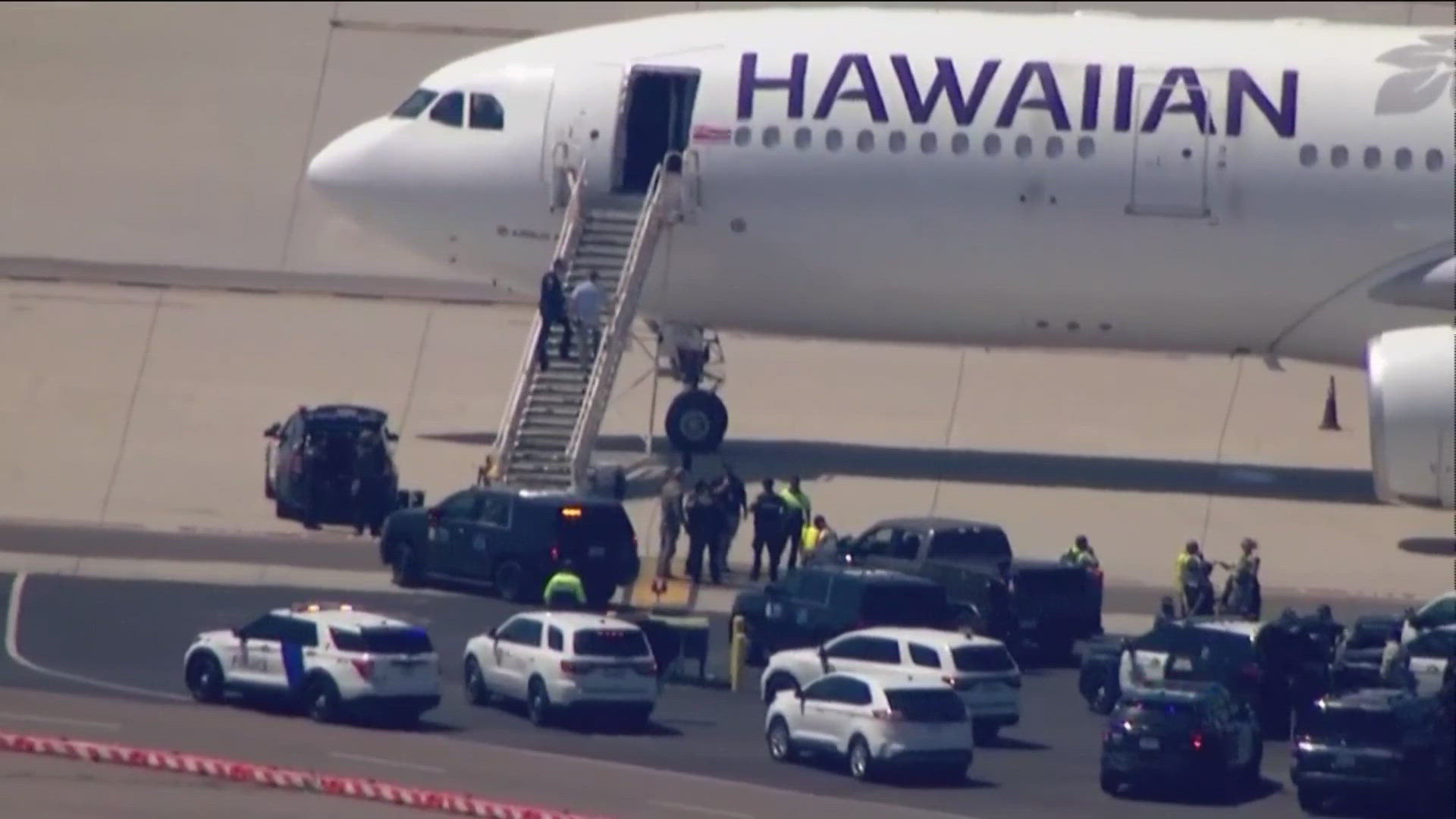 The plane had not taken off and was surrounded by emergency vehicles on the tarmac. Passengers were evacuated off the plane and loaded onto buses.
