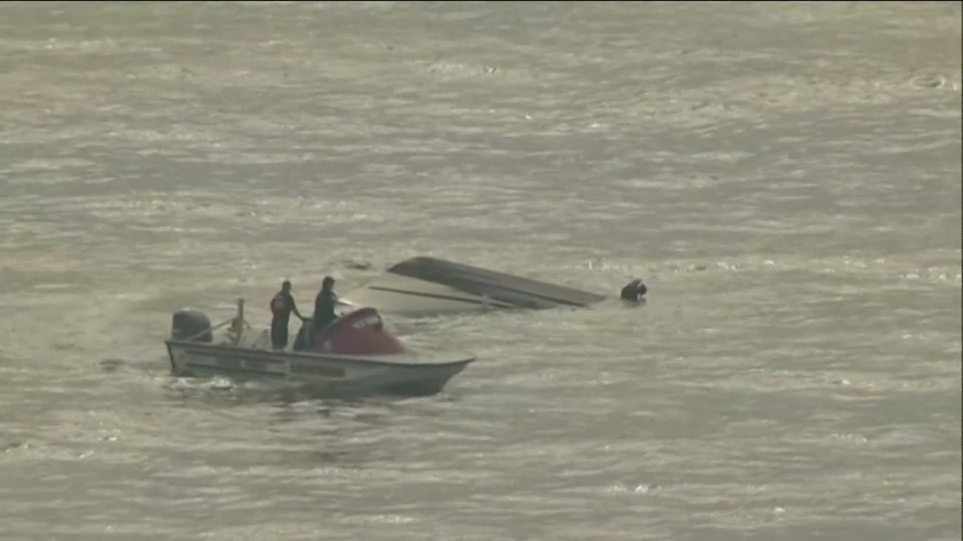 The 22 ft. cabin cruiser had a mechanical failure 200 yards off the coast. One person was stuck underneath the water in the cabin, but has since been hospitalized. 