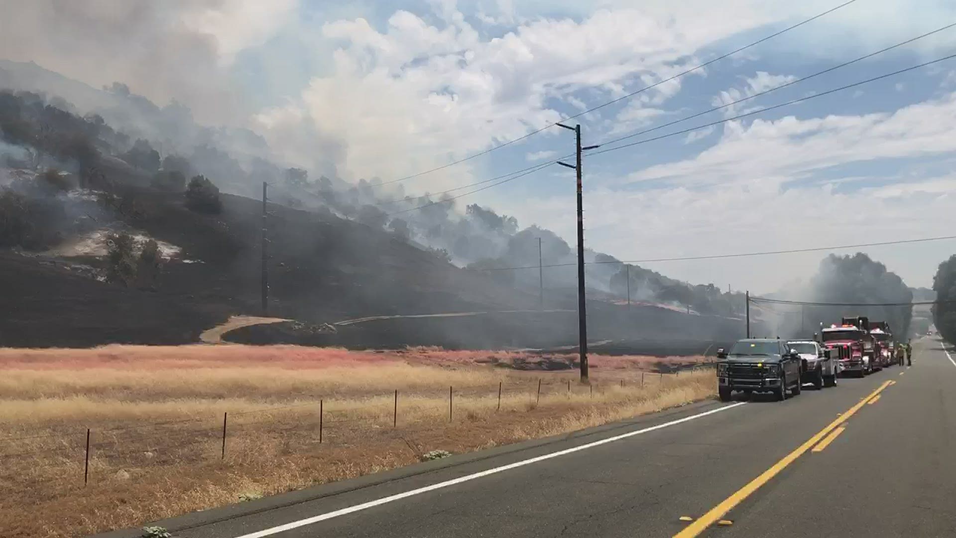 A brush fire was threatening homes and forcing residents to evacuate Saturday on School House Canyon Road, authorities said.