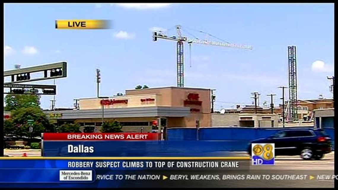 Man in crane at Texas college says he's armed