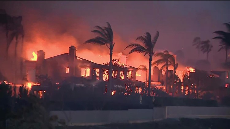 San Diego-area firefighters help battle Coastal Fire in Orange County as flames burn homes