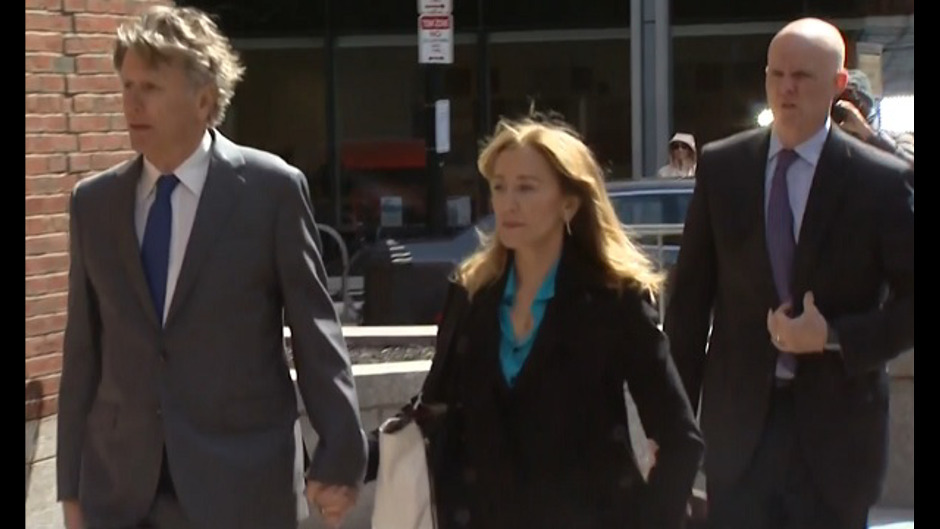 Felicity Huffman arrives in Boston court over college admissions scam.