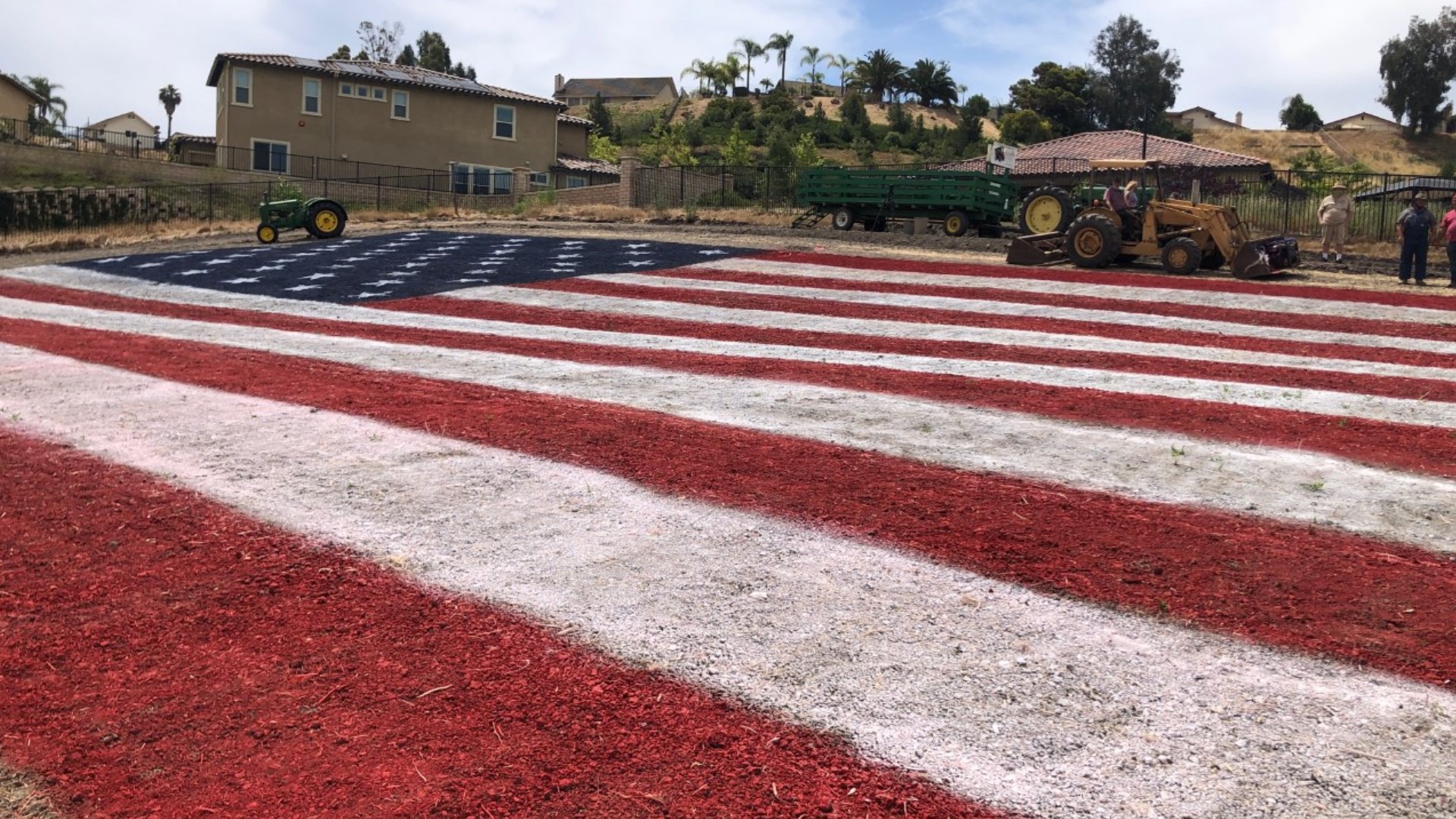 An 11,000 square foot American flag painted on a large field at the Antique Gas and Steam Engine Museum in north San Diego.