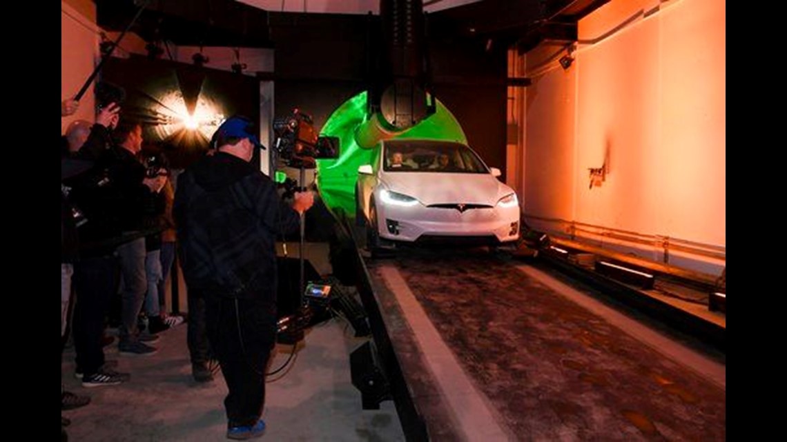 Elon Musk unveils underground tunnels, offers rides to VIPs
