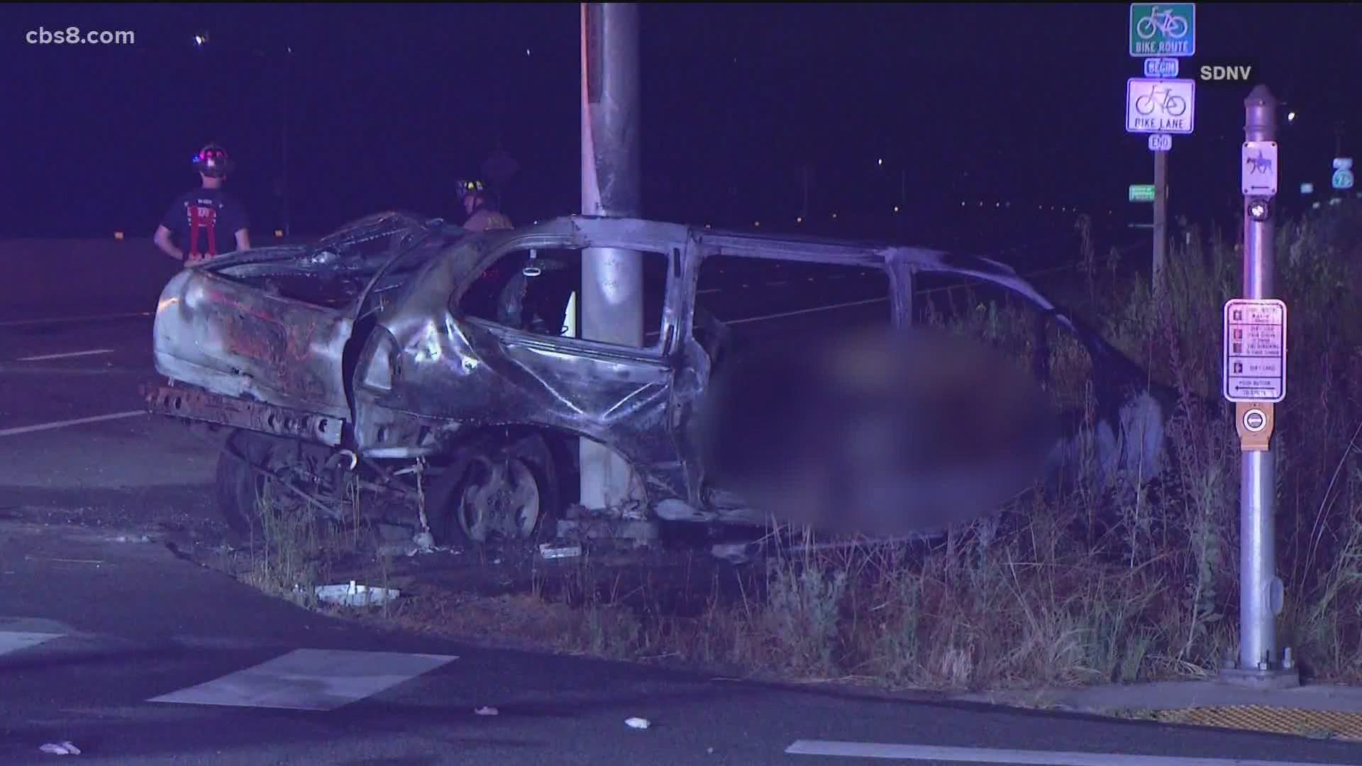 The driver of a minivan crashed into a traffic signal, sparking a fire.