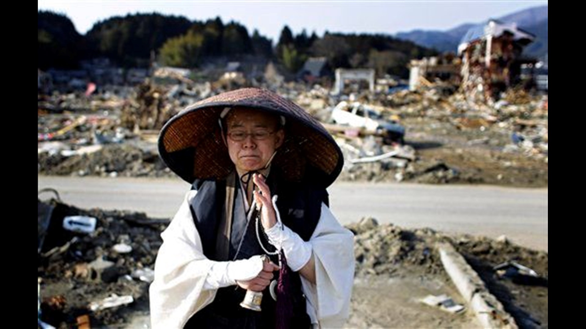 Month after quake, Japan homeless move into houses