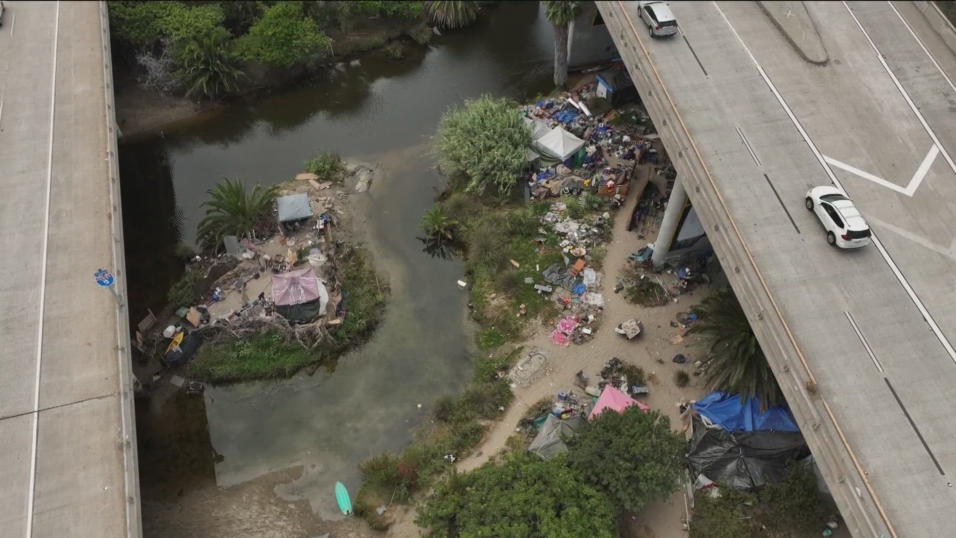 Known as the 'Island,' there's an estimated 40 people who live in the encampment, alongside 20,000 tons of debris.