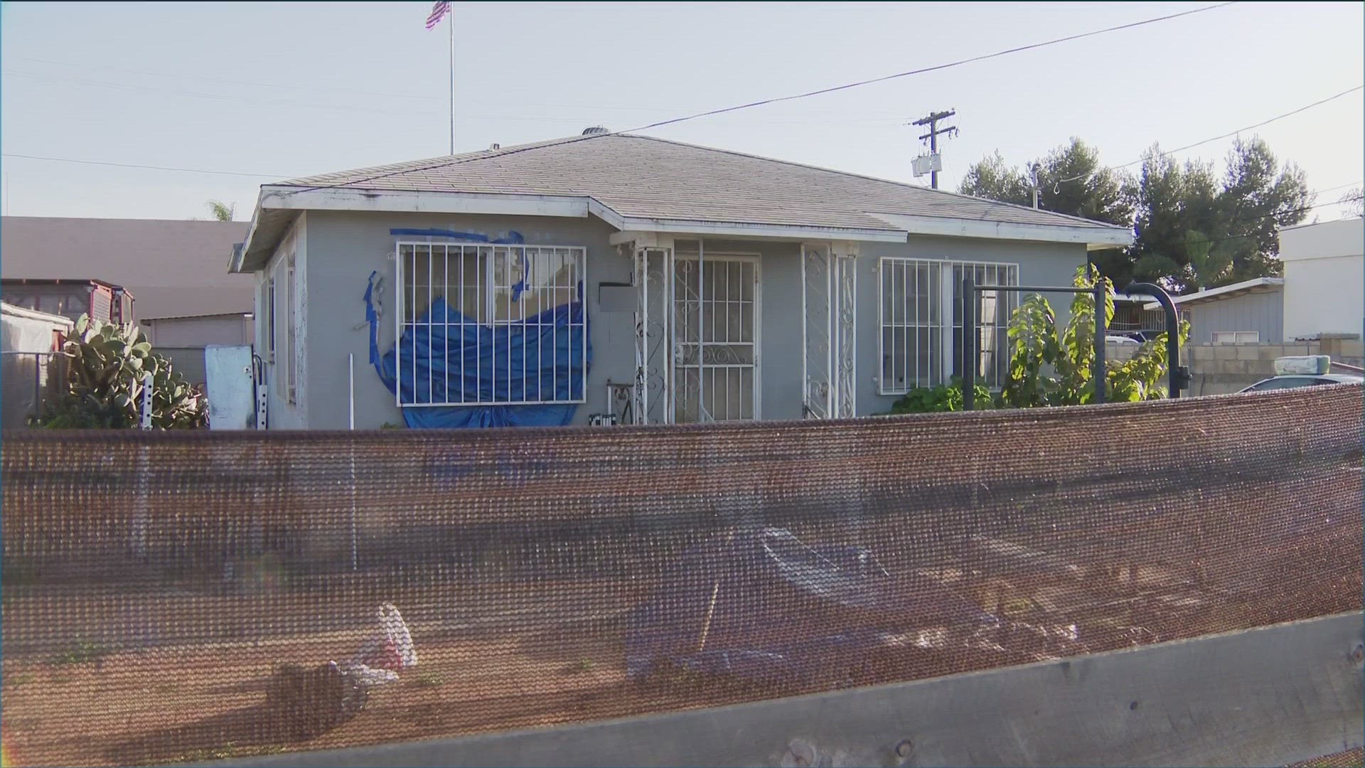 A man is in police custody after a woman reported to police she was kidnapped, sexually assaulted, and held captive with a dead woman inside a Palm City home.