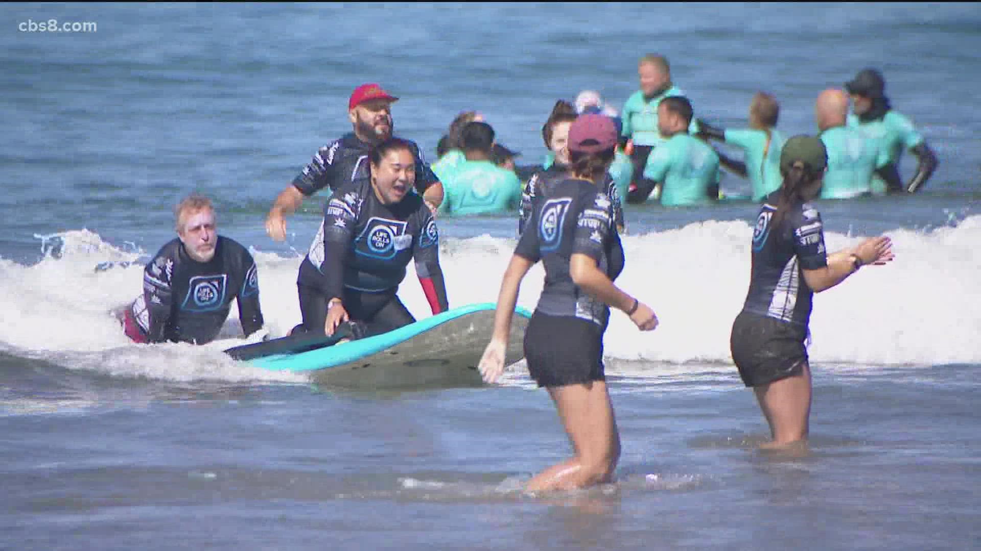Hundreds of volunteers and surfers showed up for the free event in La Jolla.