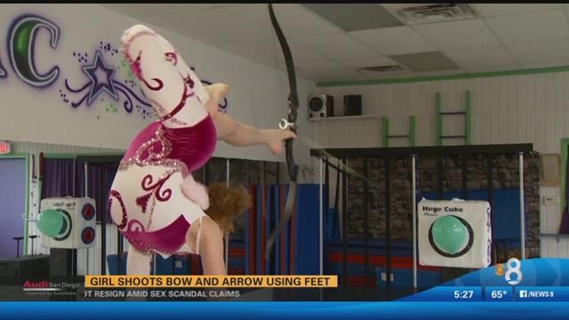 Girl Shoots Bow And Arrow With Her Feet 4477