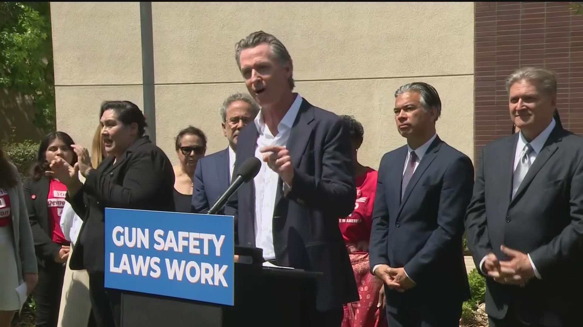 Gov. Gavin Newsom signed a controversial, first-in-the-nation gun control law patterned after a Texas anti-abortion law and urged other states to follow suit.
