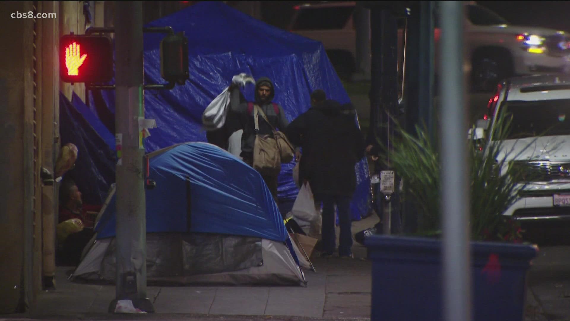 Officials say the cold, wet weather and the latest case surge is heavily impacting those experiencing homelessness in San Diego County.
