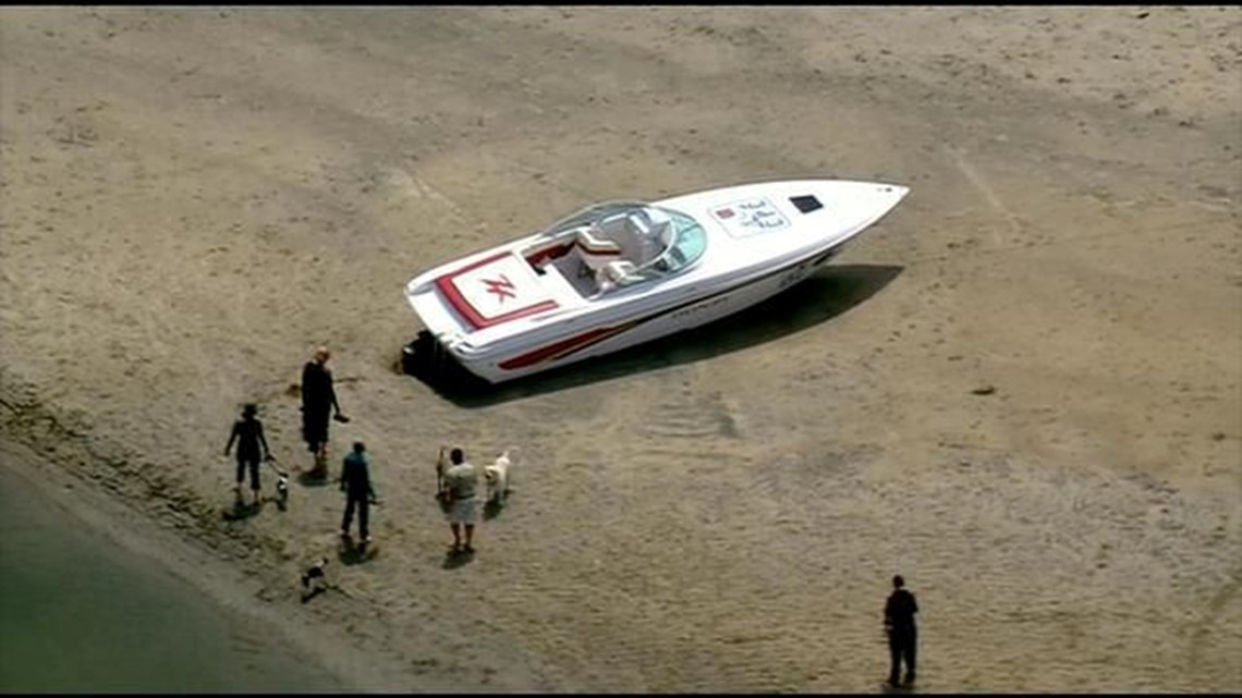 Boat stuck on sand bar at Dog Beach