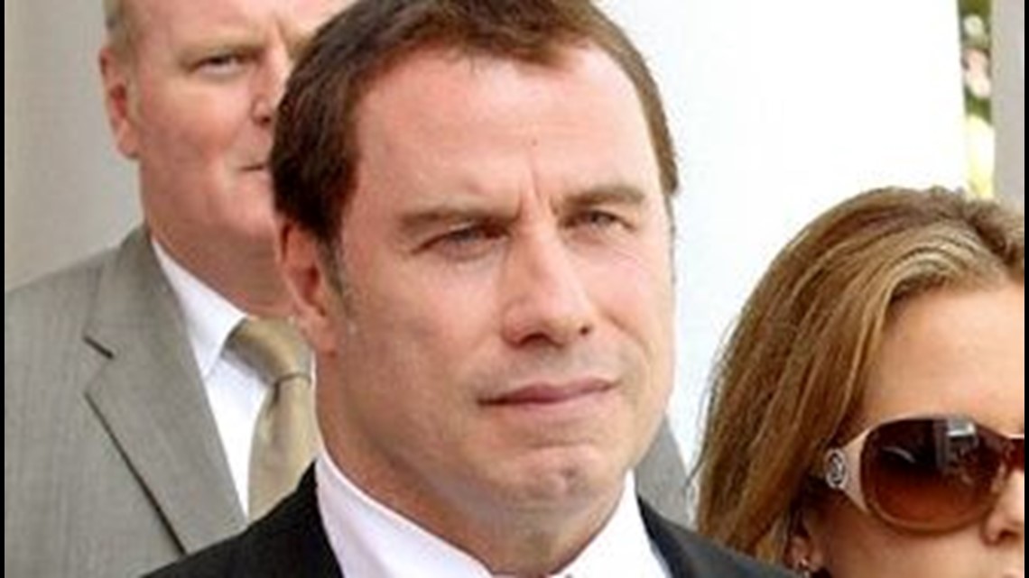 Bahamas drops charges in Travolta extortion case