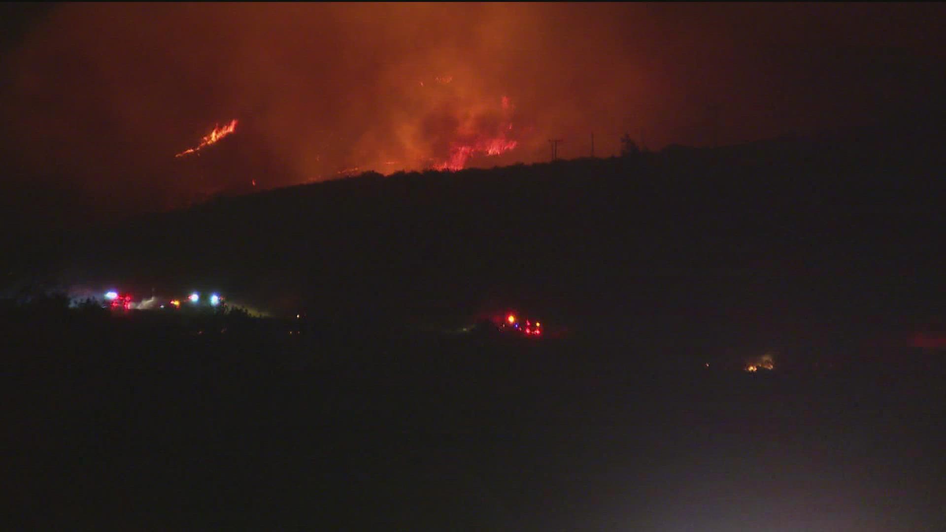 The fire in southern San Diego County has burned 4,243 acres, destroyed multiple structures, and over 400 residential units are affected by evacuations.