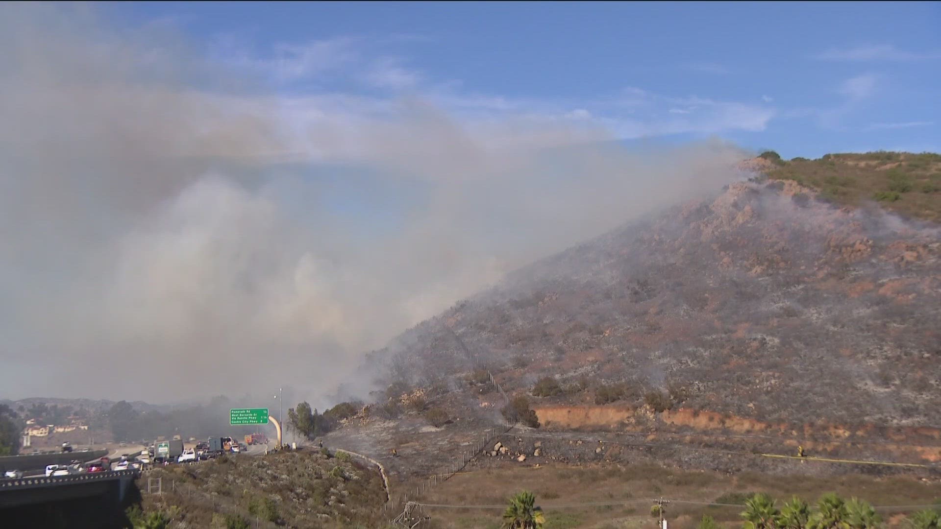 Fire crews worked quickly to extinguish the 5-acre Escala Fire burning on Battle Mountain in Rancho Bernardo alongside northbound Interstate 15 Monday afternoon.