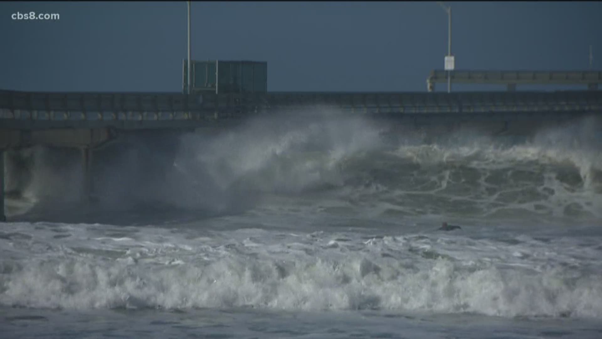 While some surfers are stoked about the swell, others are bummed that they can't walk along the OB pier.