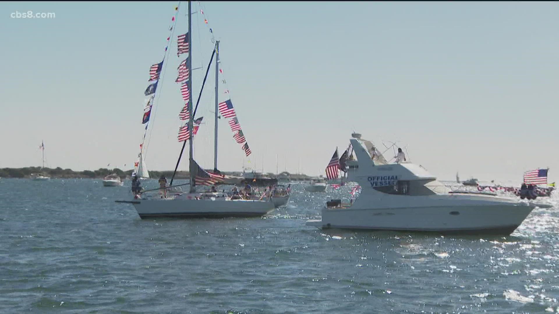 Dozens of ships decked out with American flags sailed from Harbor Island to Coronado including a Vietnam War-era swift boat that led the parade.