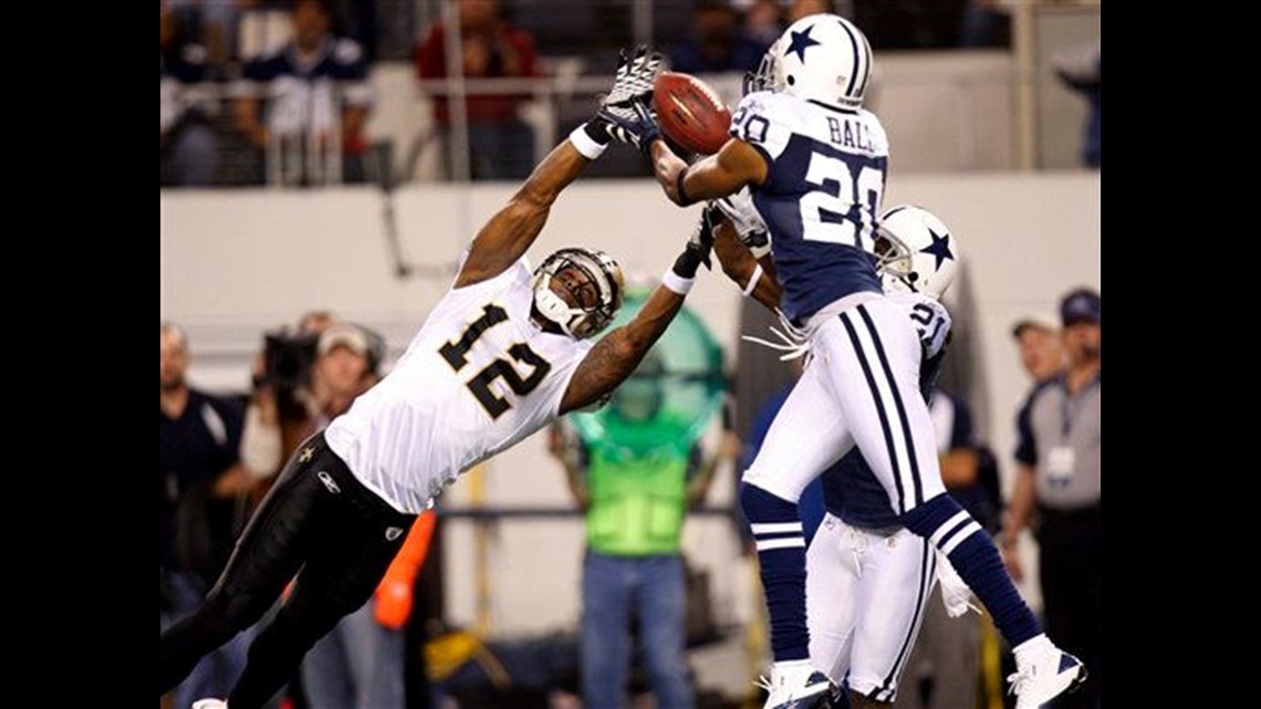 With only seconds left in the game New Orleans Saints tight end Jimmy  Graham (80) takes a Drew Brees pass 12 yards to setup the game winning 31  yard field goal by