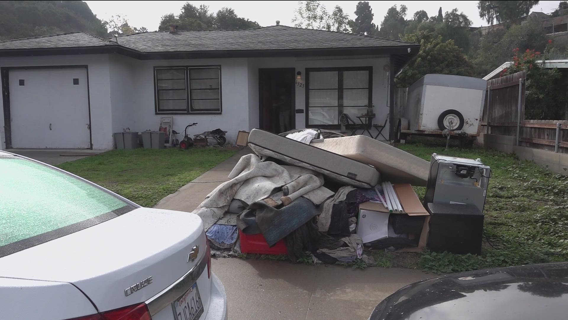 Furniture and flooring are now piled up in front yards as cleanup continued.