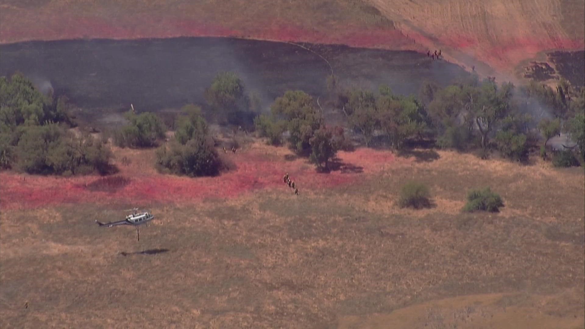 The vegetation fire blackened about three acres off Voorhes Lane near Highland Valley Road in Ramona, according to Cal Fire.