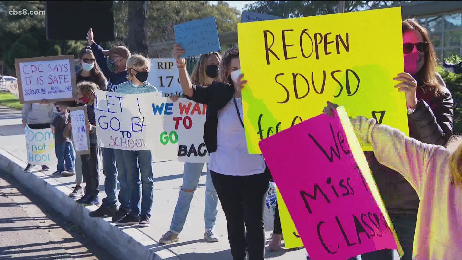 The group 'Reopen SDUSD' organized rallies outside several schools Thursday, pushing for a return to the classroom.