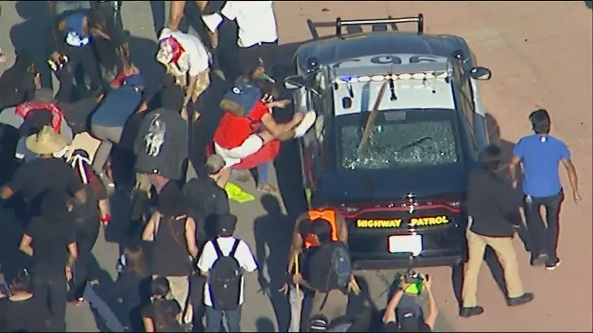 One protester was injured after reportedly jumped on the hood of a CHP cruiser and fell off when it sped away, according to an LA news station.