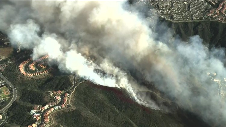 Fire crews battle wildfire in Laguna Hills as flames burn multiple structures
