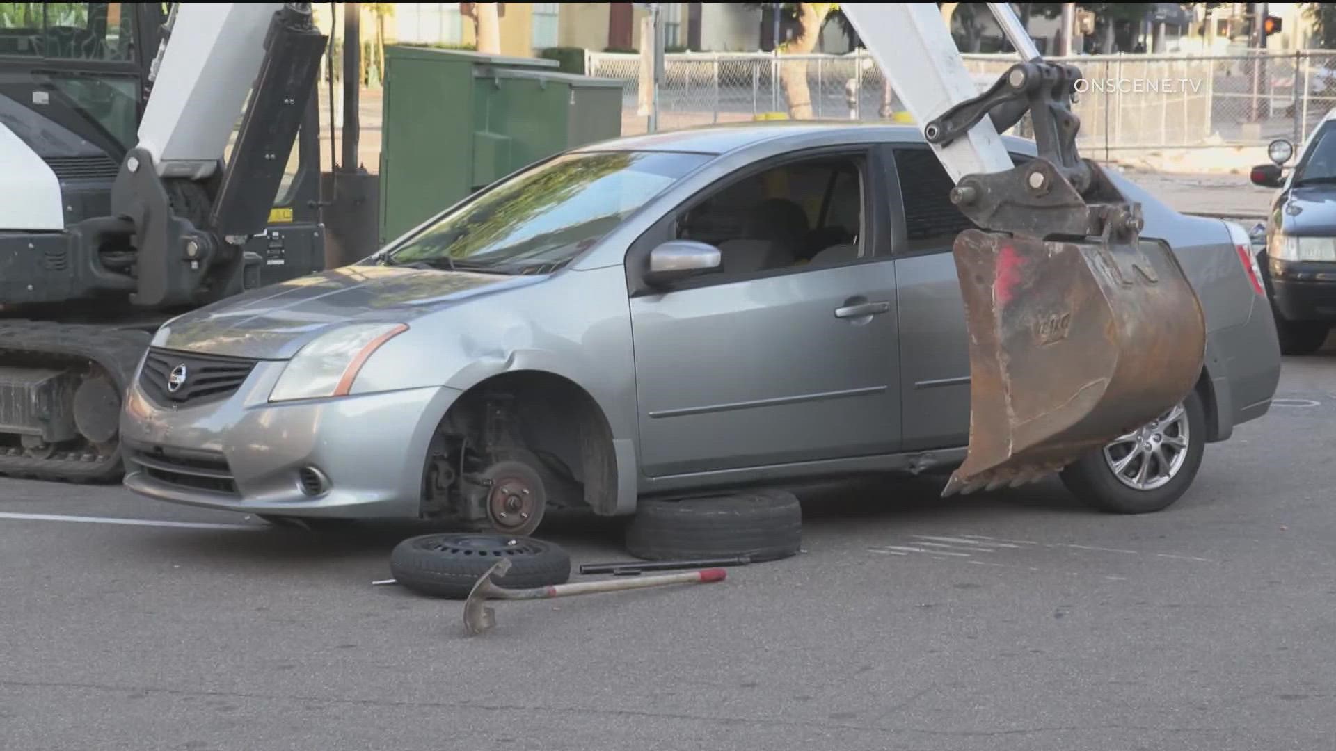 "I was helping somebody," the suspect said. A homeless man was arrested for stealing an excavator in Downtown San Diego to help someone change their tire.