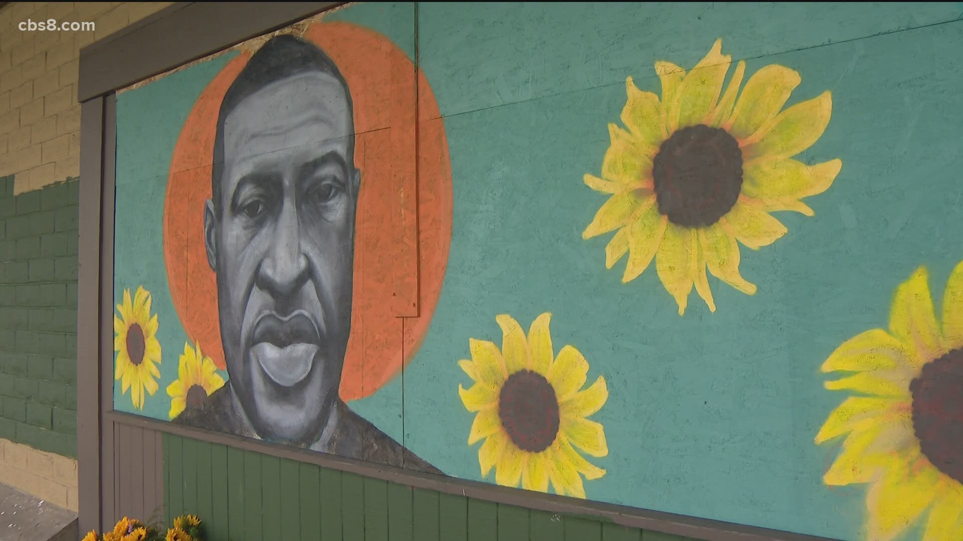 An East County resident reached out to fellow painters and sculptors to create murals on the large bare pieces of plywood that are covering broken windows in La Mesa