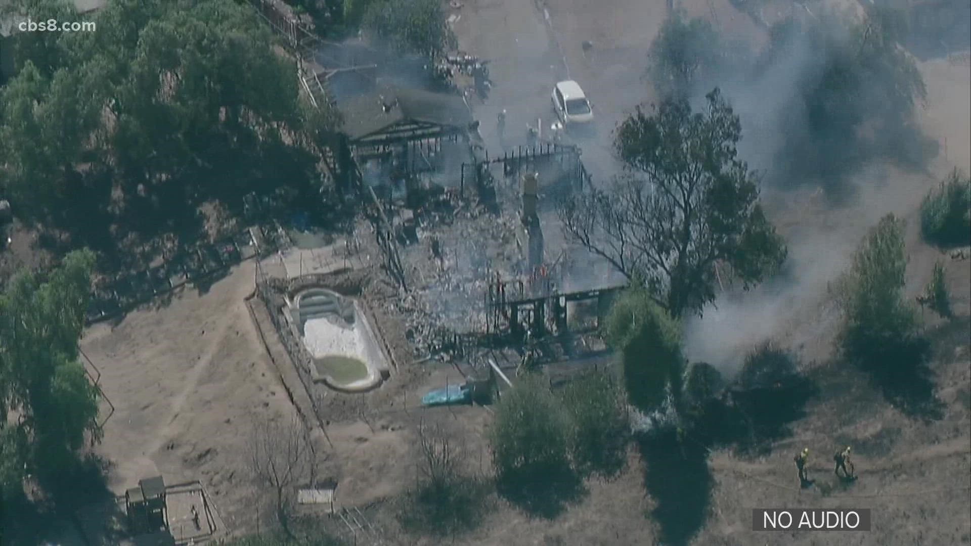 Fire crews extinguished a fire that engulfed a house on Dehesa Road Friday afternoon in eastern San Diego County.